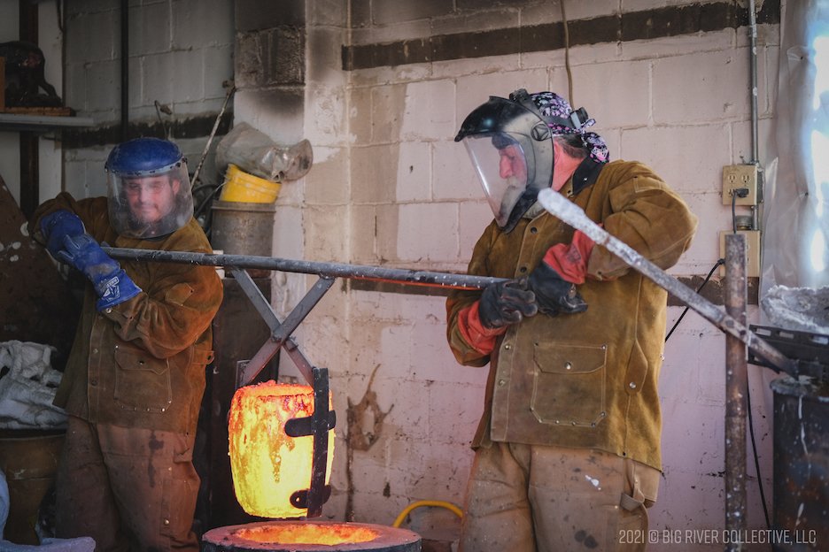 The 2-man process requires hoisting molten bronze from the foundry fires and pouring it into each hot cast